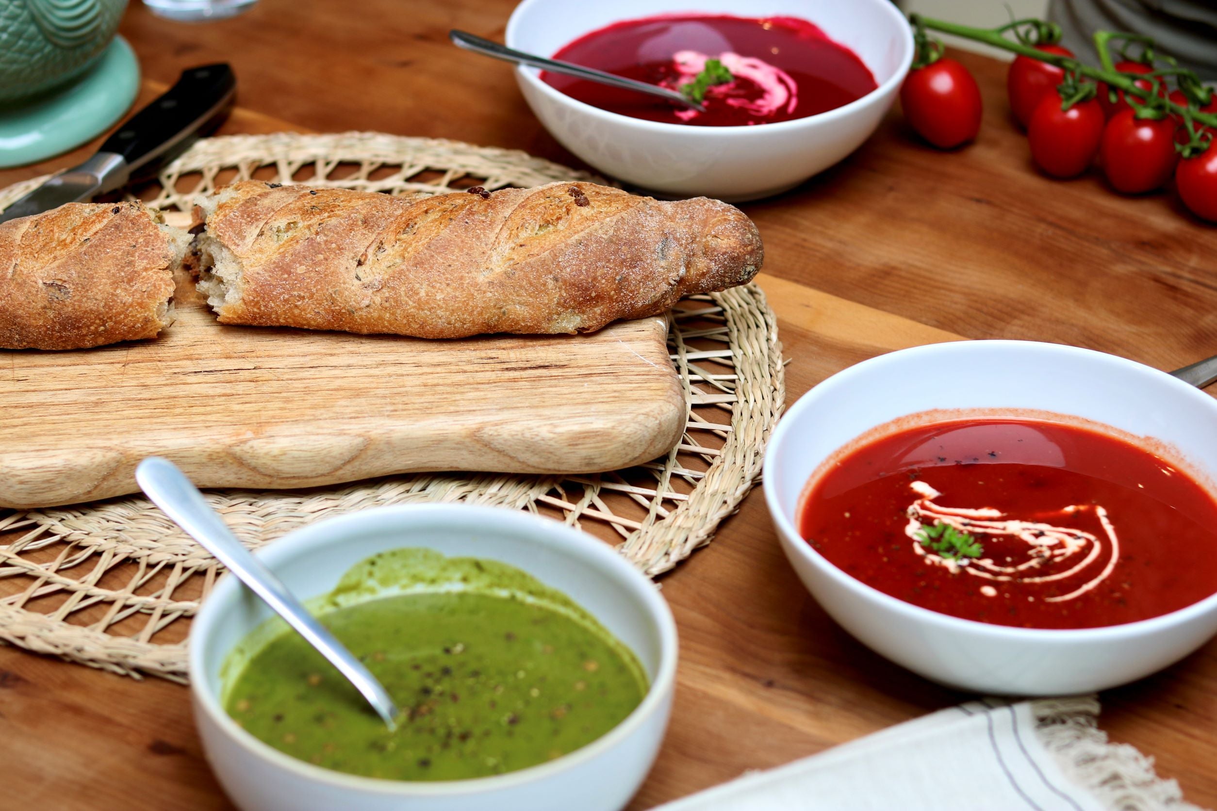 Photo of soup on a table with fresh bread